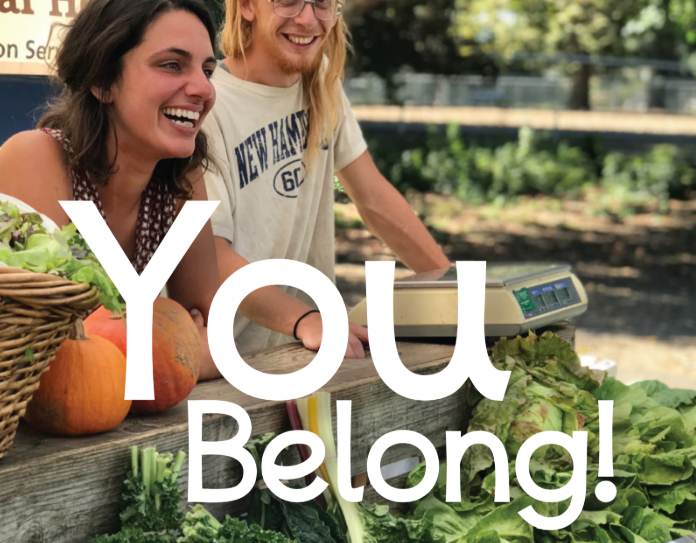 Man and women selling produce at a market